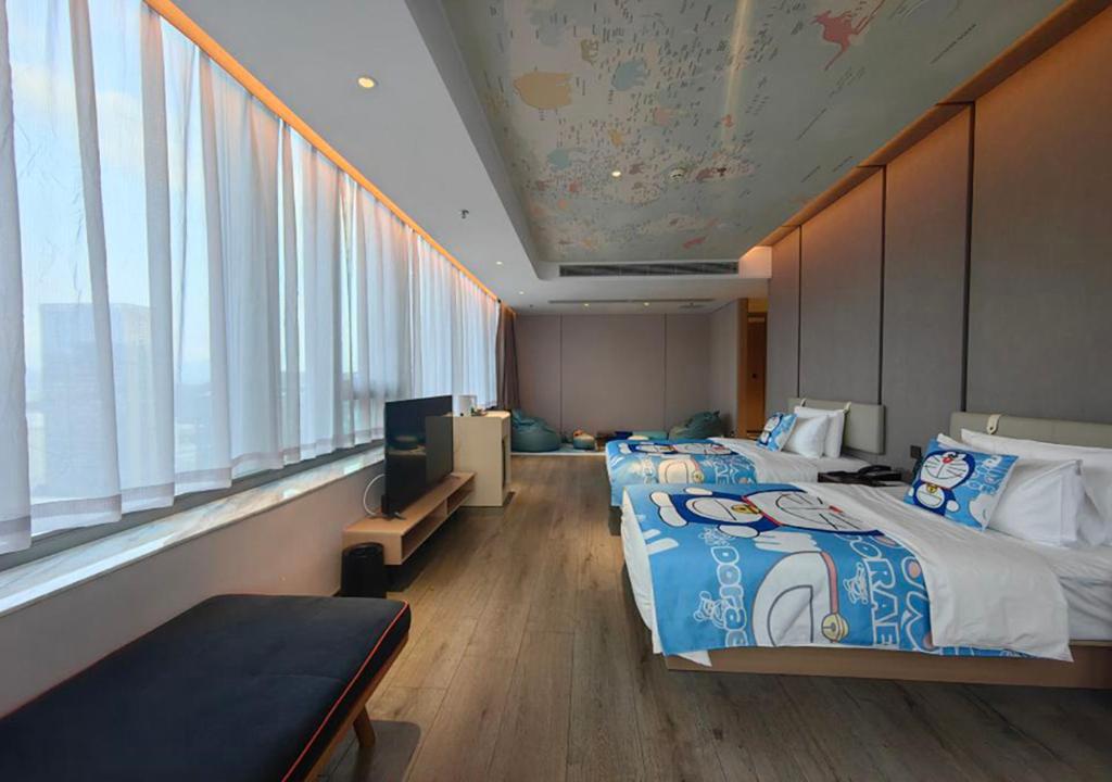 Postel nebo postele na pokoji v ubytování Atour Hotel Shenzhen Luohu Shuibei IBC