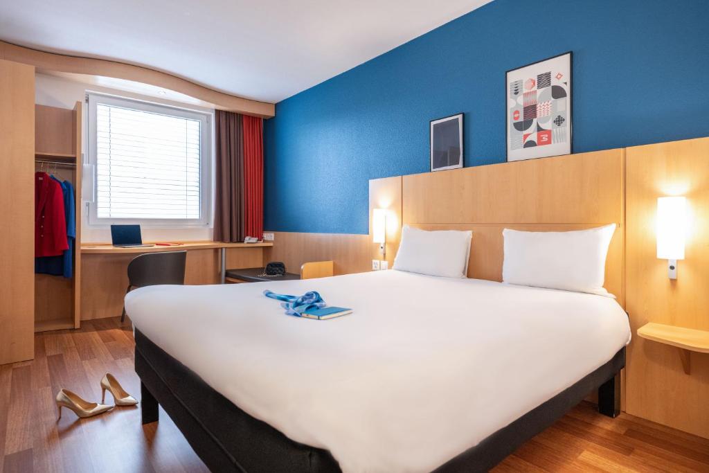 Postel nebo postele na pokoji v ubytování ibis Genève Centre Nations