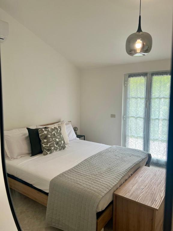 Postel nebo postele na pokoji v ubytování Ardesia apartment
