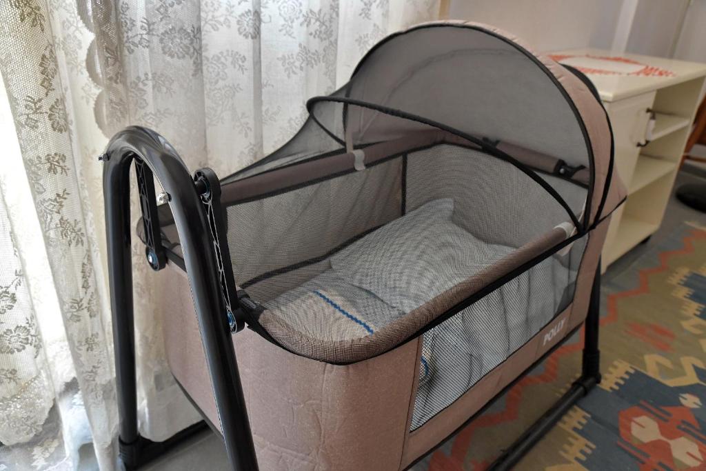 Postel nebo postele na pokoji v ubytování Mimas Garden Apartments
