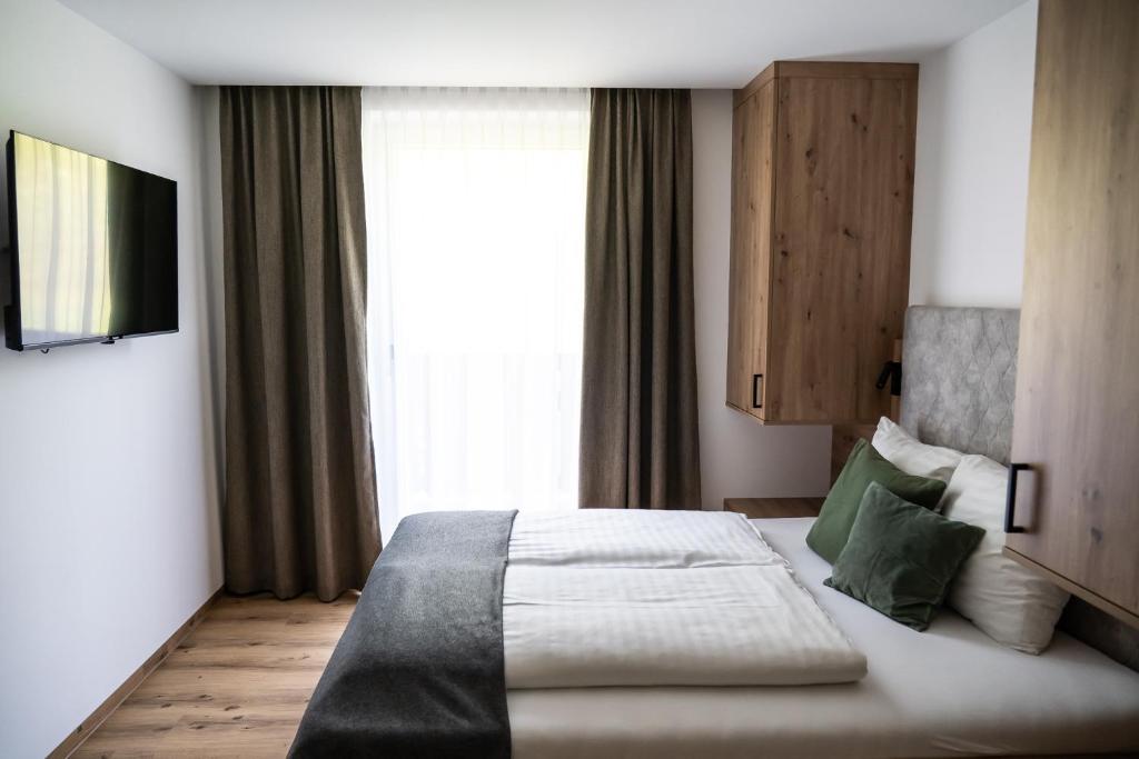 Postel nebo postele na pokoji v ubytování Gasthof Schöntal