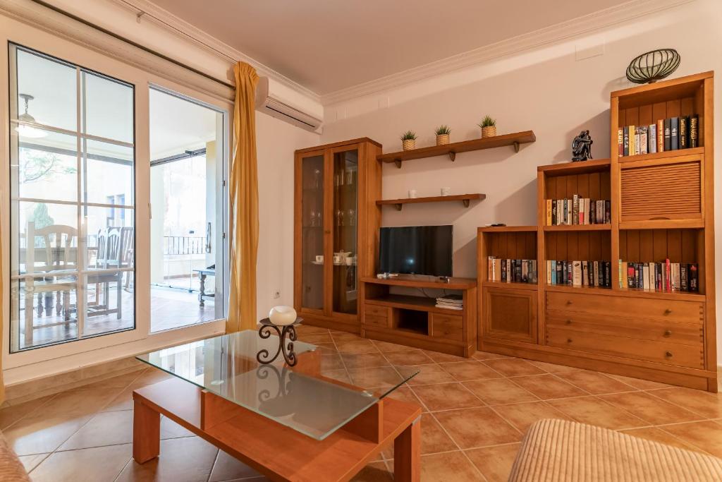 TV a/nebo společenská místnost v ubytování Playa Canela I by Ĥ