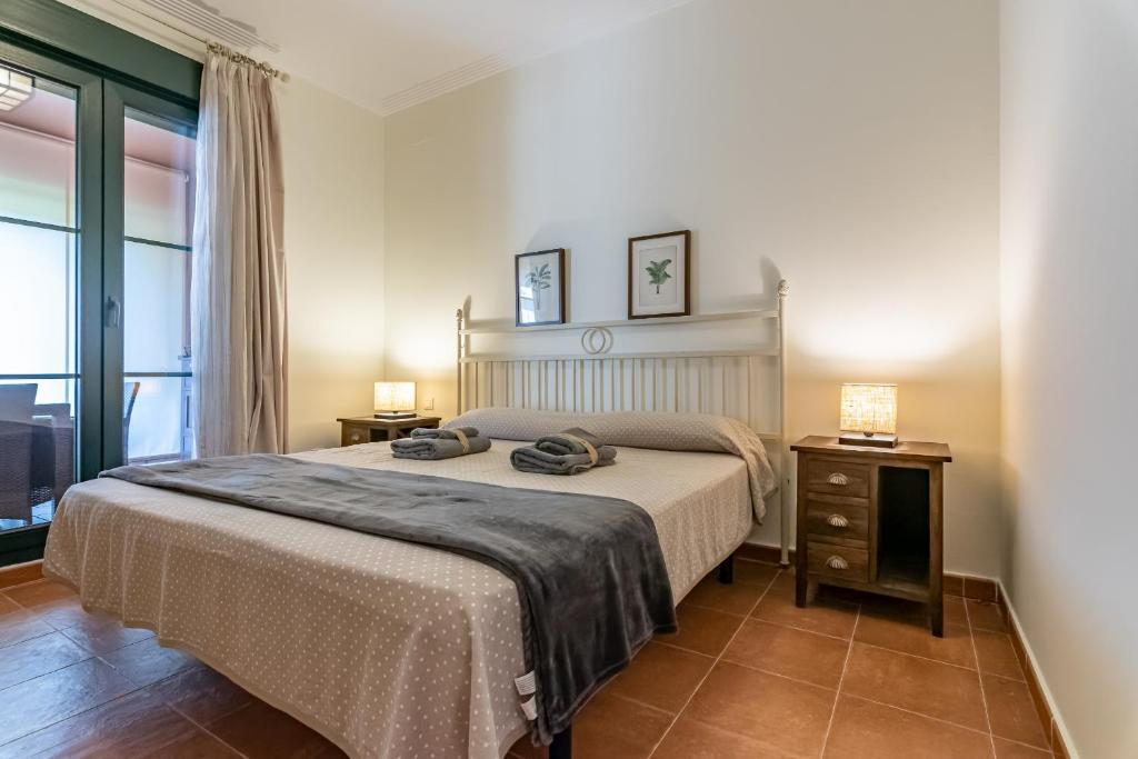 A bed or beds in a room at El Rincon del Golf II by Ĥ - Isla Canela Golf GRHII18P21
