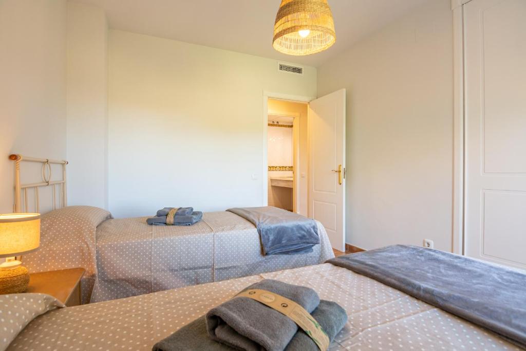 Postel nebo postele na pokoji v ubytování La Quinta I by Ĥ
