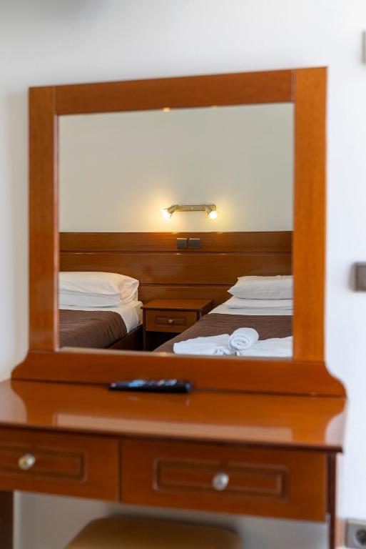 A bed or beds in a room at Maria's Beach Apartments