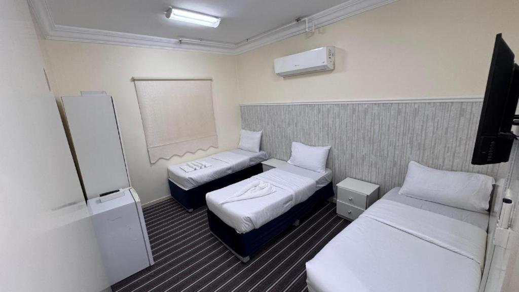 Postel nebo postele na pokoji v ubytování فندق درة الإستبرق