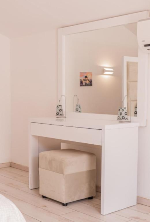 a white desk in a bedroom with a mirror at Sea side apartment in Kotor