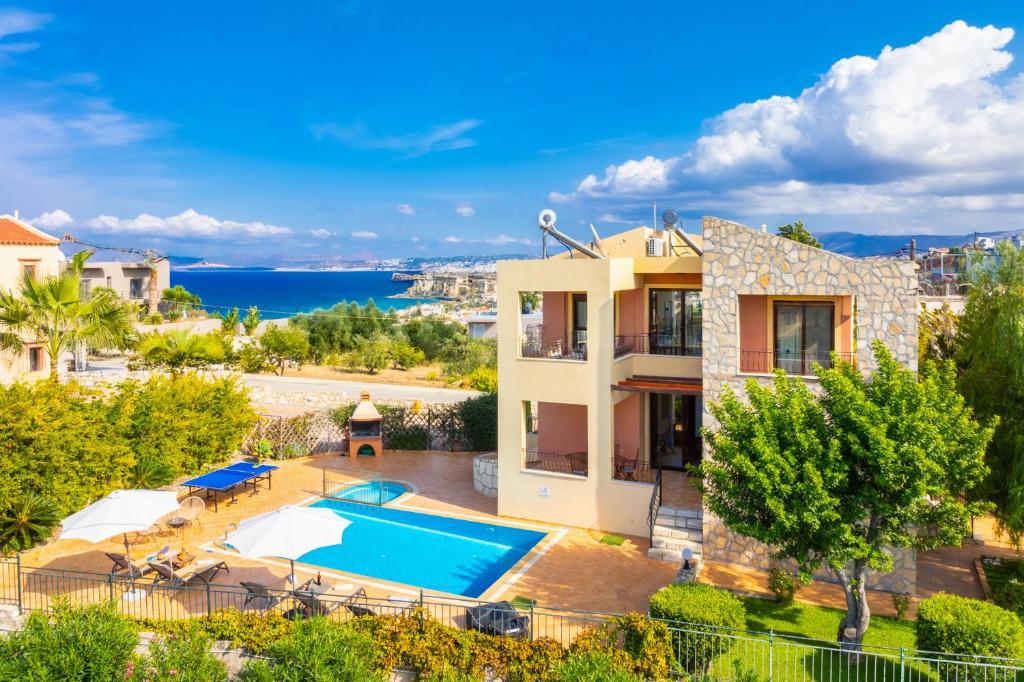 an aerial view of a villa with a swimming pool at Villa Pasiphae 1 in Stalos