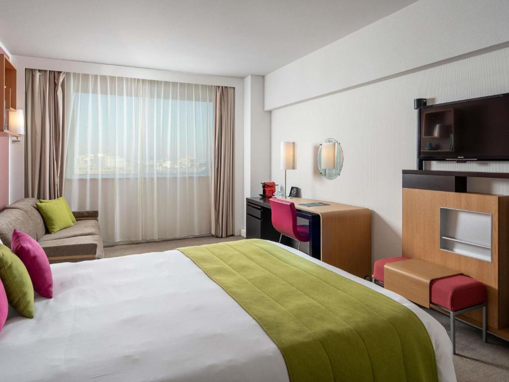Cama ou camas em um quarto em Novotel Bucharest City Centre