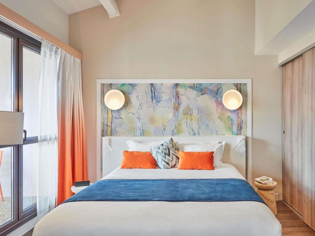 Кровать или кровати в номере Aparthotel Adagio Aix-en-Provence Centre
