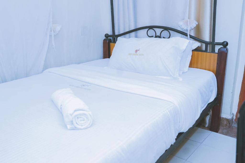 Postel nebo postele na pokoji v ubytování Lazarus Kaka Hotel Urbane