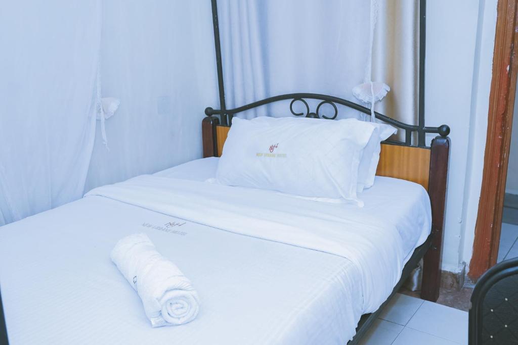Postel nebo postele na pokoji v ubytování Lazarus Kaka Hotel Urbane