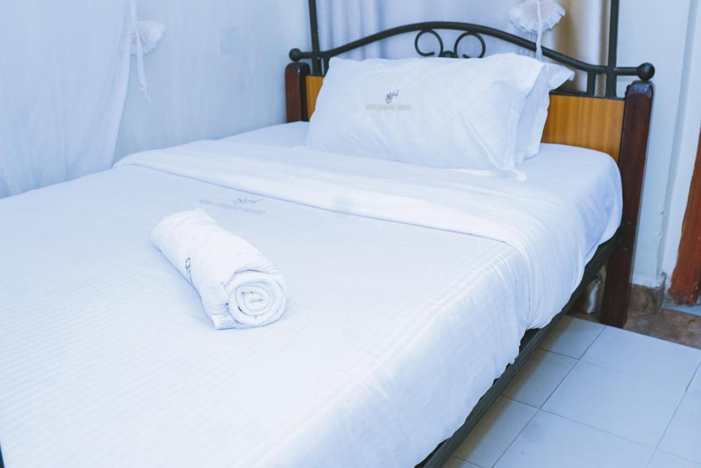 Postel nebo postele na pokoji v ubytování Lazarus Kaka Hotel Urbane