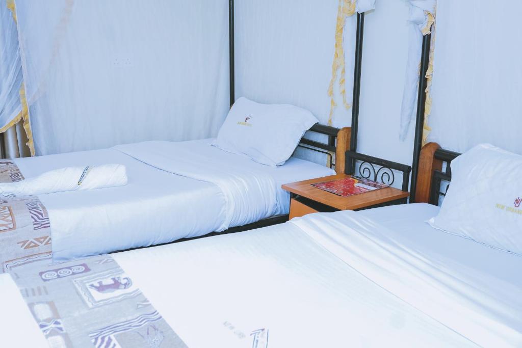 Postel nebo postele na pokoji v ubytování Lazarus Kaka Hotel Urbane