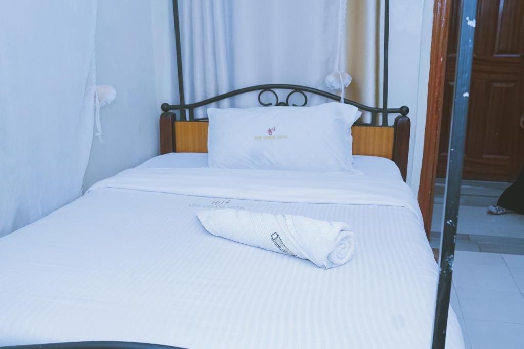 Postel nebo postele na pokoji v ubytování Lazarus Kaka Hotel Urbane