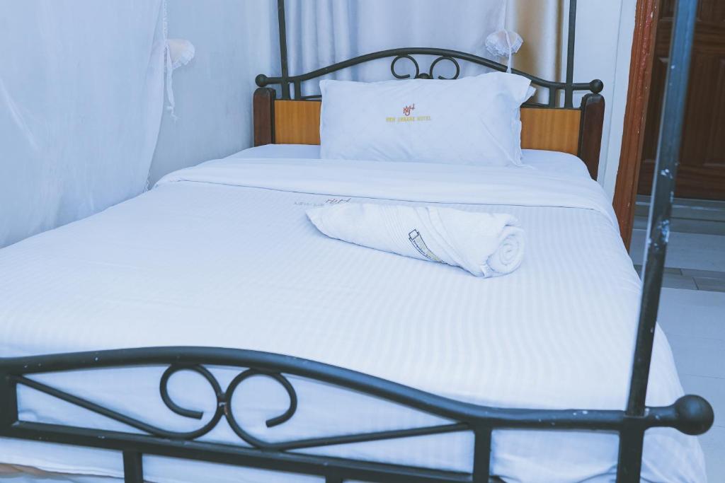 Postel nebo postele na pokoji v ubytování Lazarus Kaka Hotel Urbane