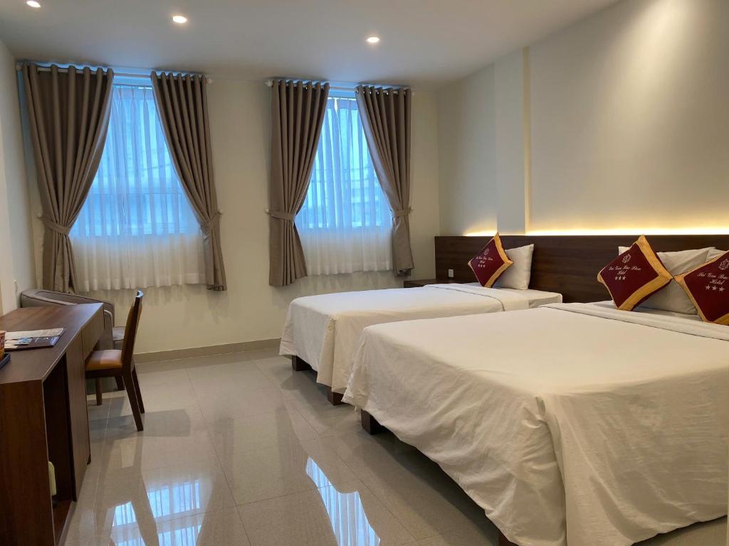 Postel nebo postele na pokoji v ubytování SÀI GÒN - BẠC LIÊU Hotel