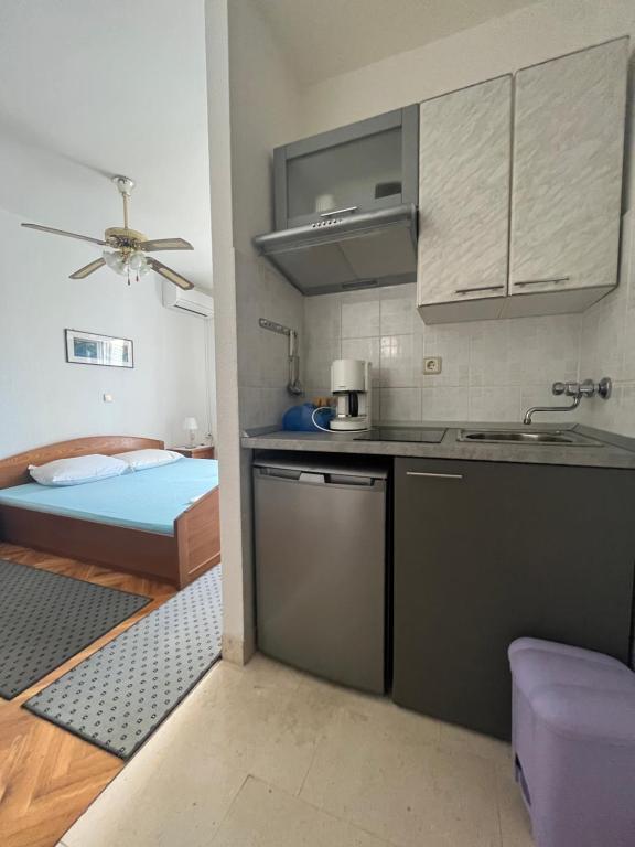 Kuchyň nebo kuchyňský kout v ubytování Apartments Vuksan