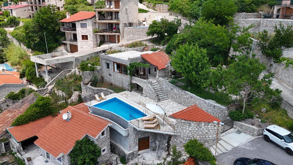 an aerial view of a house with a swimming pool at Villa Jana Lapčići in Lapčići