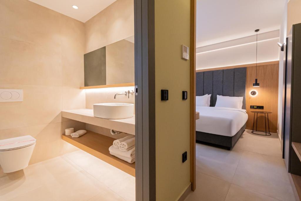 Postel nebo postele na pokoji v ubytování Sokratis Hotel