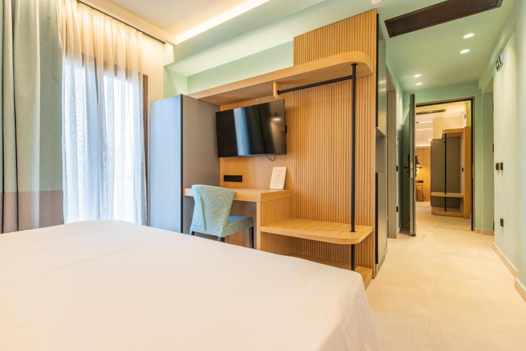 Postel nebo postele na pokoji v ubytování Sokratis Hotel