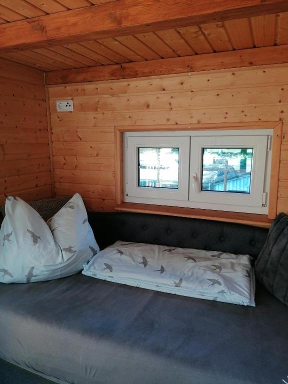 Postel nebo postele na pokoji v ubytování Weidmannsruh Natur pur - exklusives Tiny house