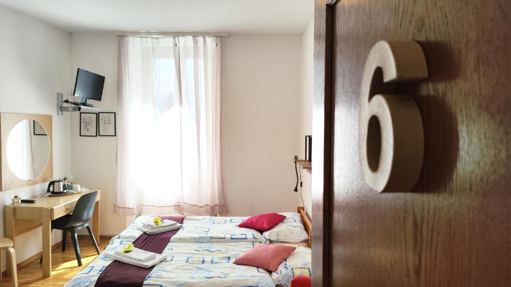 Postel nebo postele na pokoji v ubytování Hotel Scaletta