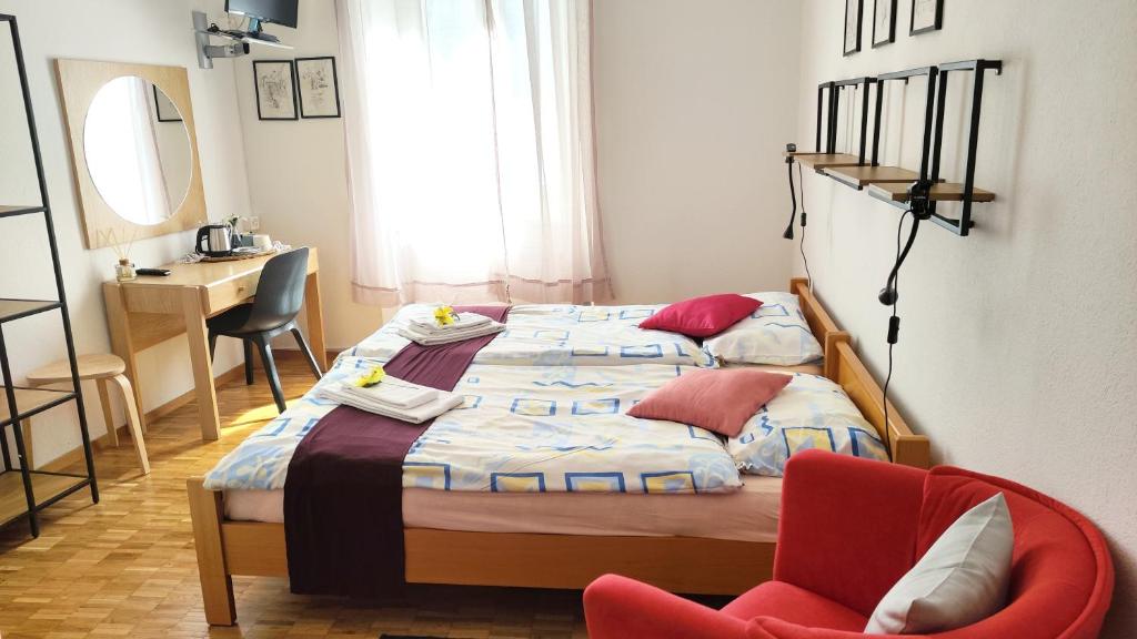 Postel nebo postele na pokoji v ubytování Hotel Scaletta
