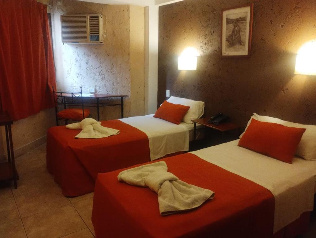 Una cama o camas en una habitación de Hotel Samka