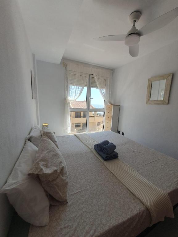 A bed or beds in a room at Alquilaencanarias-Medano, Cabezo beach, sea views!