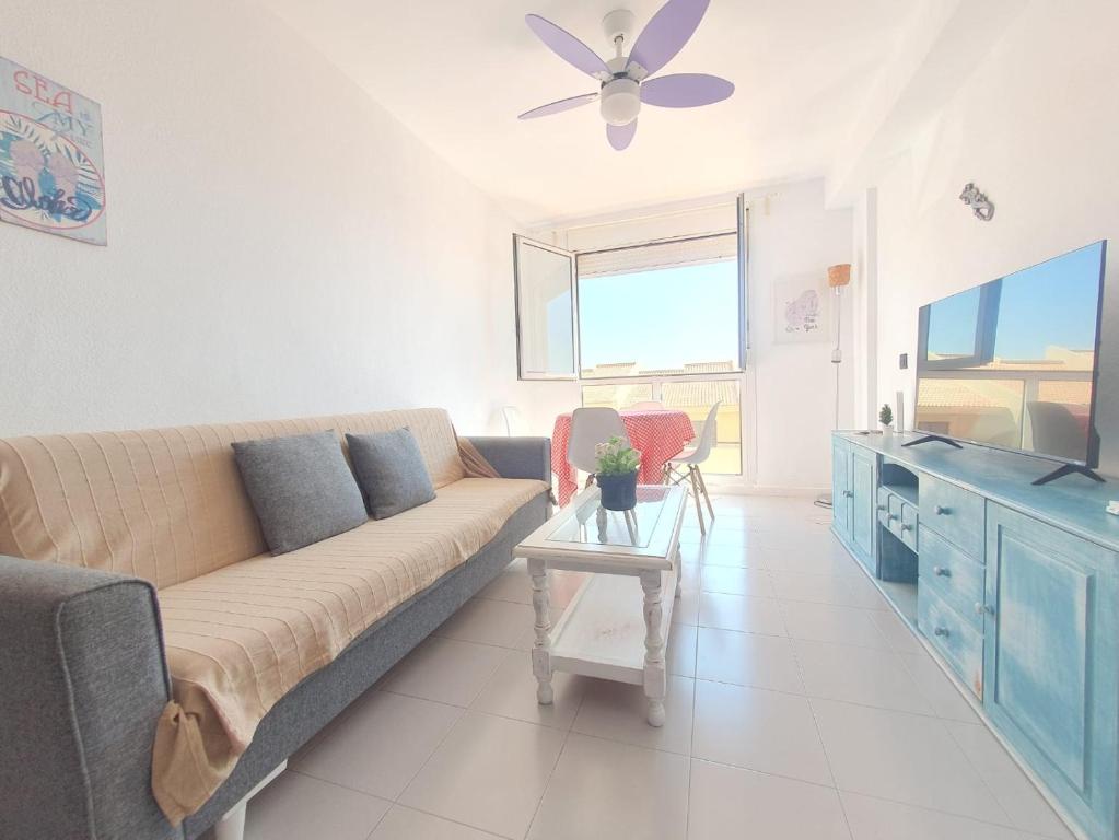 A television and/or entertainment centre at Alquilaencanarias-Medano, Cabezo beach, sea views!