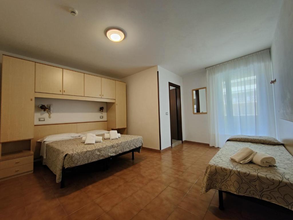 Postel nebo postele na pokoji v ubytování Hotel Anna