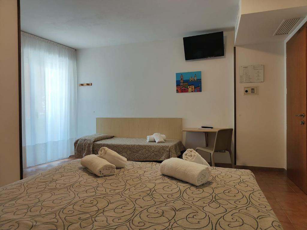 Postel nebo postele na pokoji v ubytování Hotel Anna
