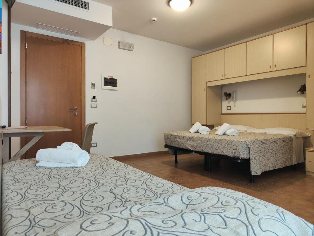 Postel nebo postele na pokoji v ubytování Hotel Anna