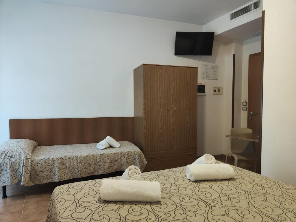 Postel nebo postele na pokoji v ubytování Hotel Anna
