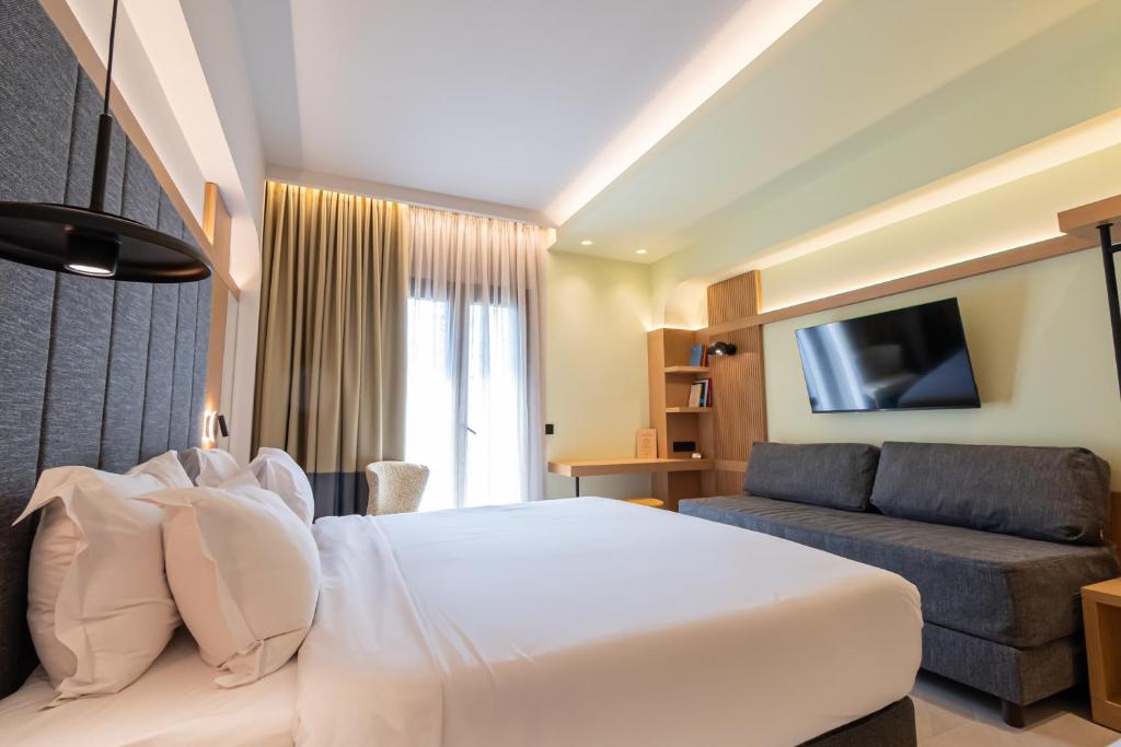 Postel nebo postele na pokoji v ubytování Sokratis Hotel
