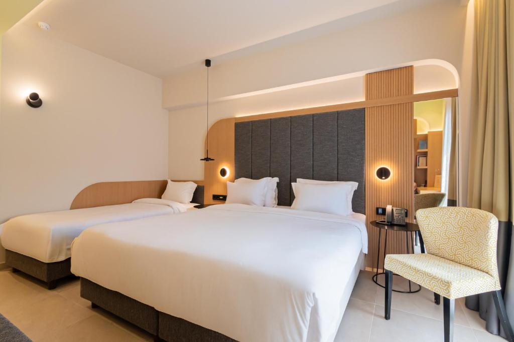 Postel nebo postele na pokoji v ubytování Sokratis Hotel