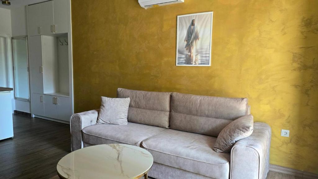 a living room with a couch and a table at Apartments Villa Joja in Međugorje