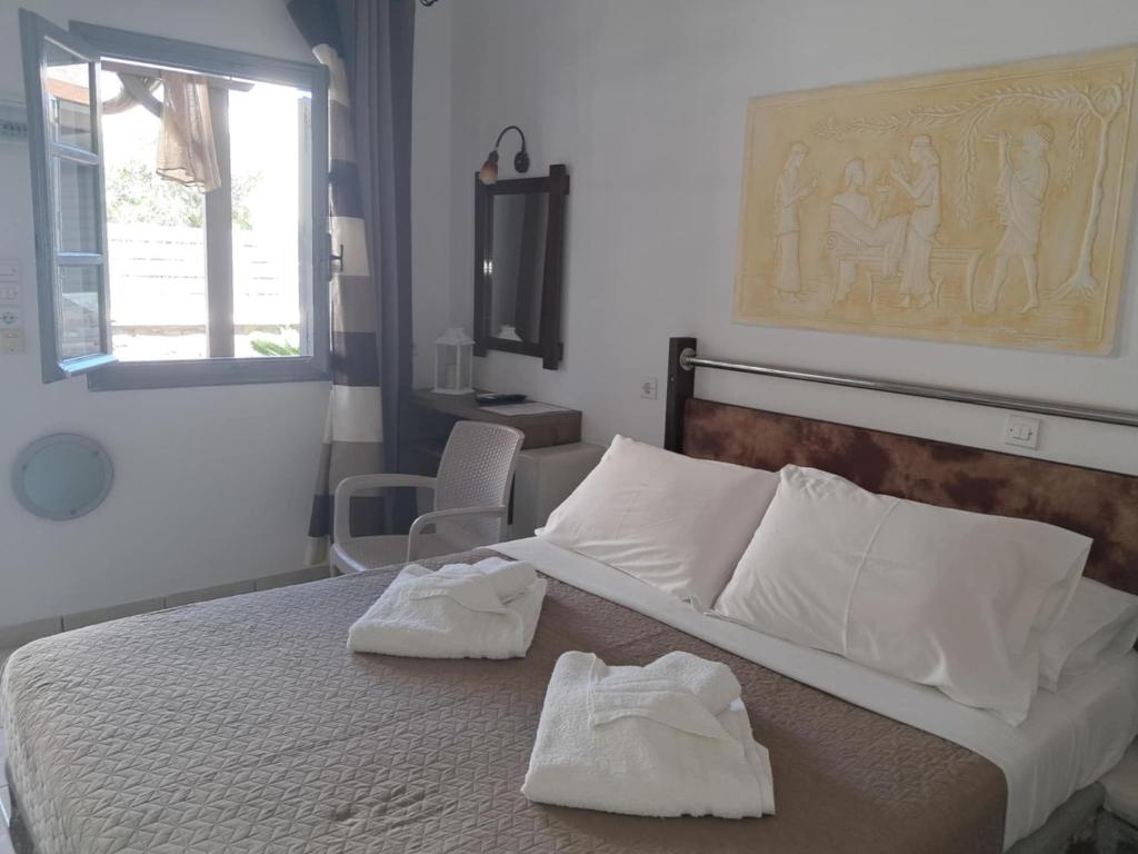 Letto o letti in una camera di Villa Nektaria