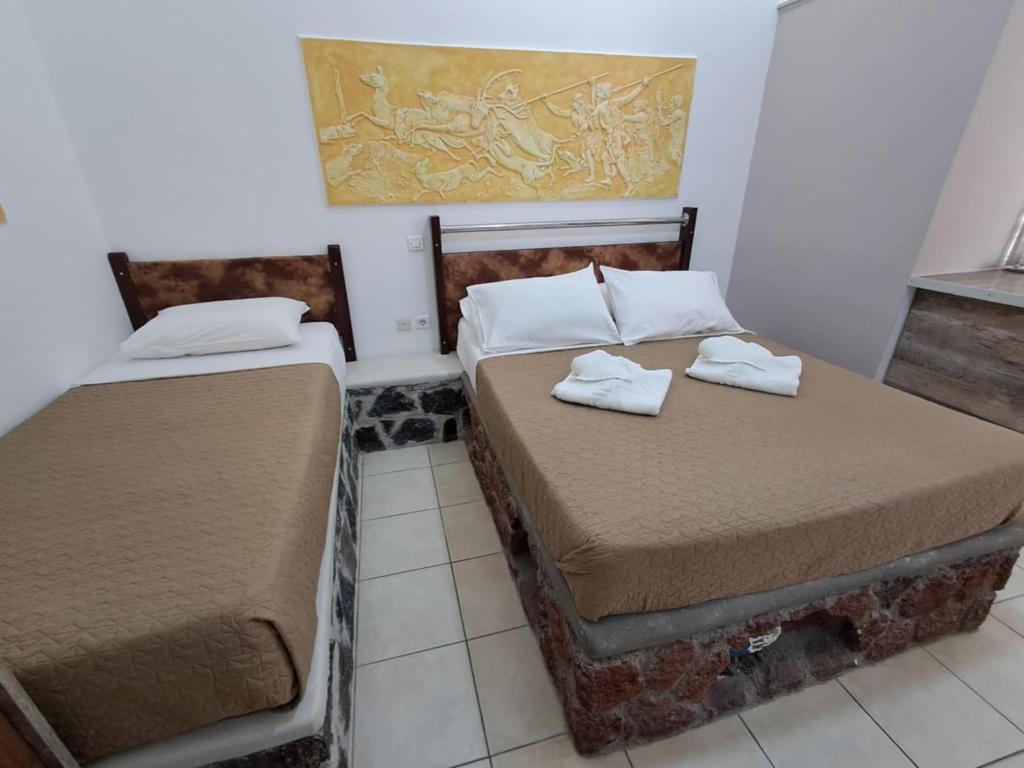 Letto o letti in una camera di Villa Nektaria