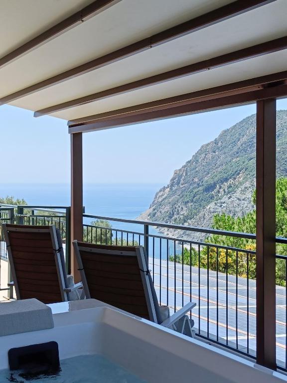 a balcony with chairs and a view of the ocean at La Cabana Cinque Terre Monterosso in Monterosso al Mare