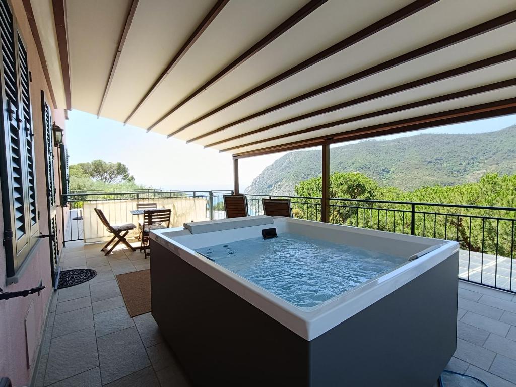 a large bath tub on a balcony with a view at La Cabana Cinque Terre Monterosso in Monterosso al Mare