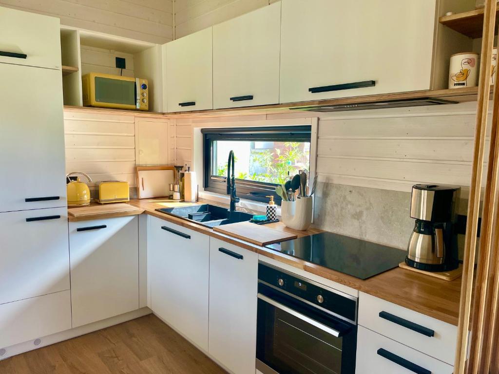 Kuchyň nebo kuchyňský kout v ubytování Tinyhaus Josie von Tinyhaus Steinhude