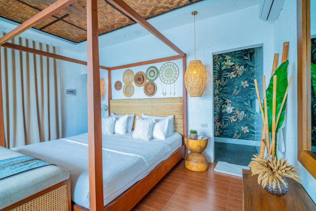 Postel nebo postele na pokoji v ubytování Pearl Bay Villas Private Resort