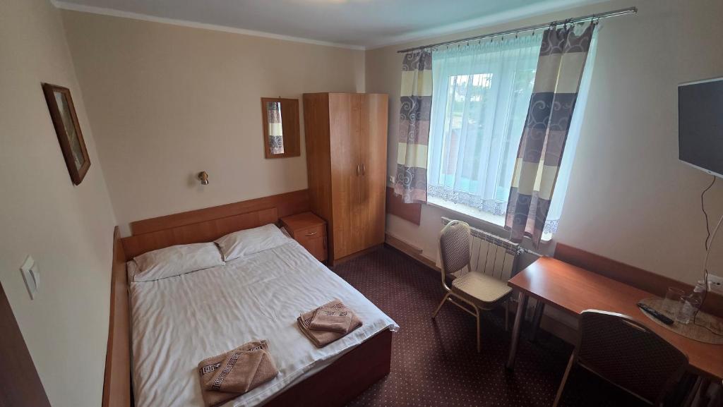 Łóżko lub łóżka w pokoju w obiekcie Hotel-Restauracja-Bar Rudka