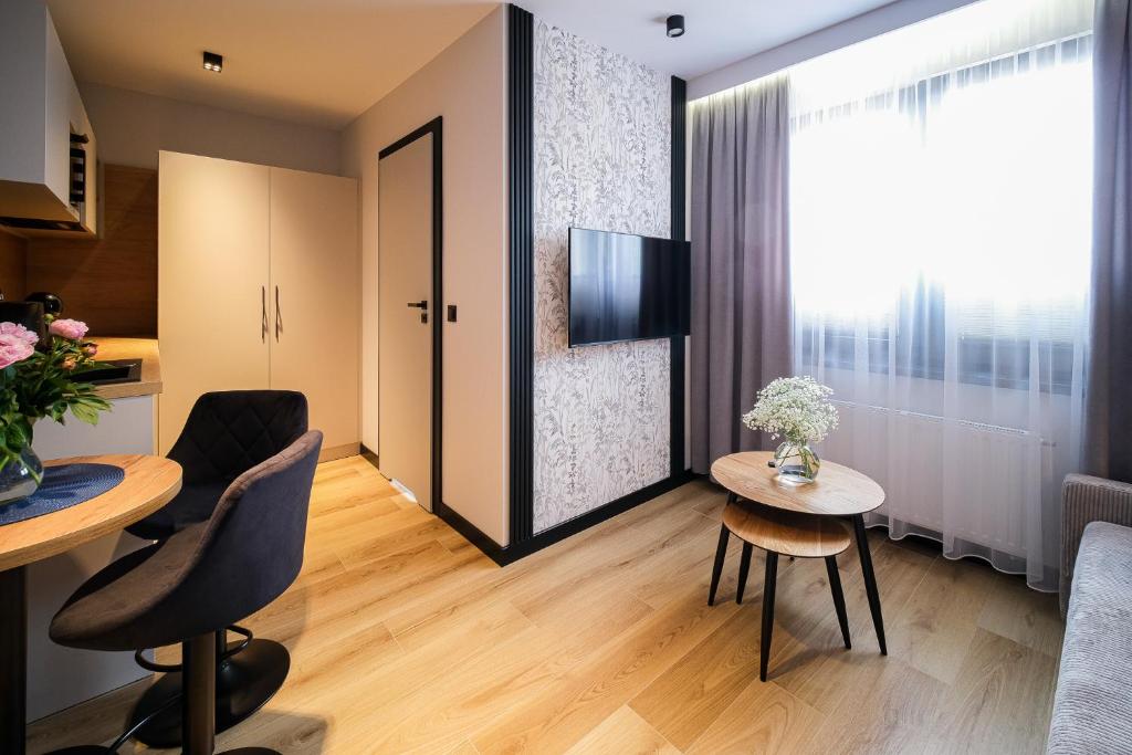 Telewizja i/lub zestaw kina domowego w obiekcie Apartamenty i Pokoje Złotobrzeg