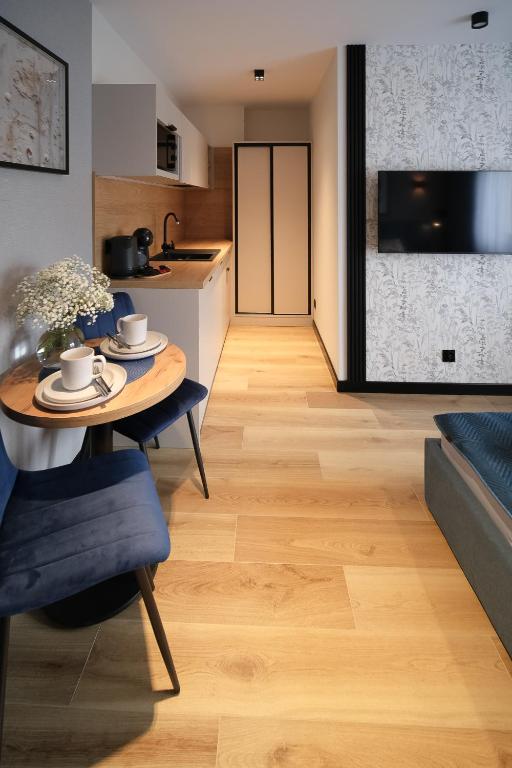 Telewizja i/lub zestaw kina domowego w obiekcie Apartamenty i Pokoje Złotobrzeg