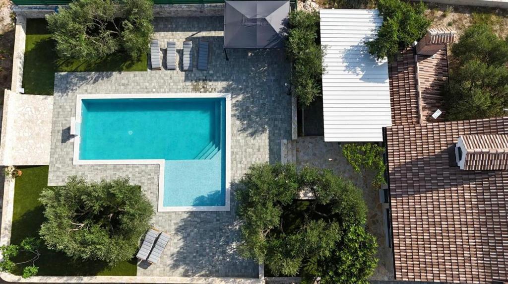 an overhead view of a swimming pool in a house at Barba Ive - Holiday Home with Pool in Vodice