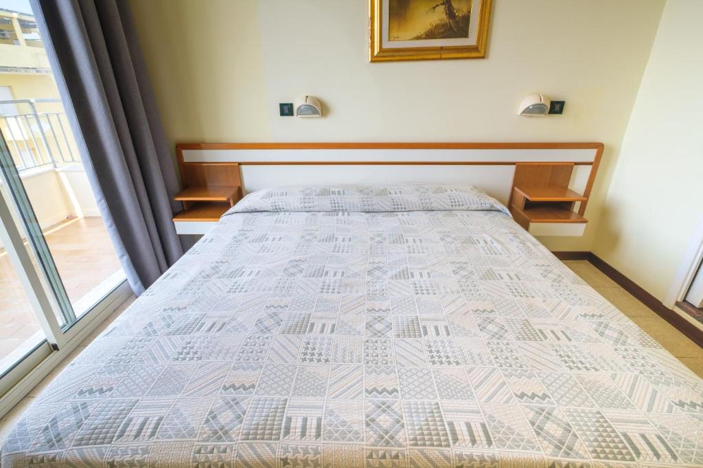 Postel nebo postele na pokoji v ubytování Hotel Classic - Azzurro Club
