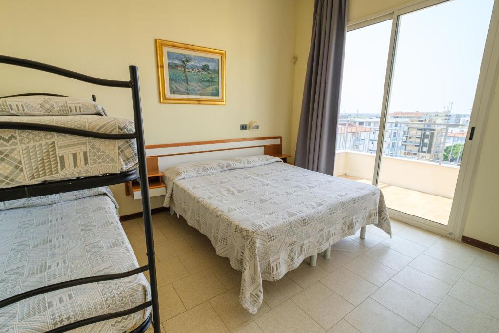 Postel nebo postele na pokoji v ubytování Hotel Classic - Azzurro Club